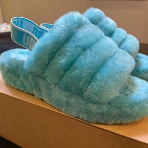 Fun, fuzzy blue UGG Fluff Yeah slides with strap. Super comfy, in great shape!